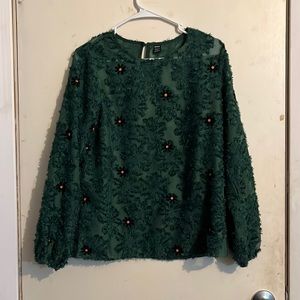 Green shirt with black flowers
